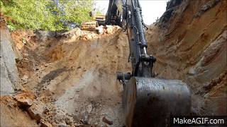 Excavator_Digging_A_Borrow_Pit.gif